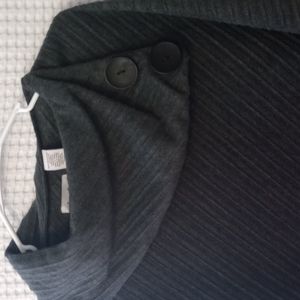 Dark gray fleece throw over shaw